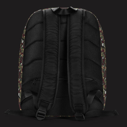 a backpack with a camo and paint and gritty skulls pattern in burgundy and green