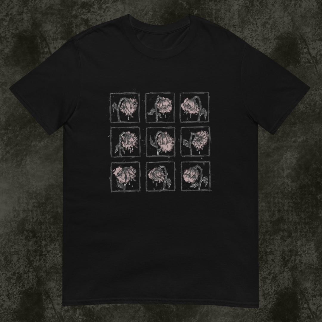 A black gildan 64000 tee with a grid of sad crying flowers in soft pink