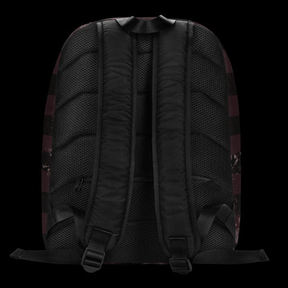 a grunge striped backpack in deep burgundy red and black, with a grungy collage that's visible close-up. 