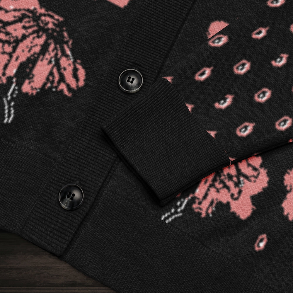 An emotional black knitted cardigan with tears and crying flowers