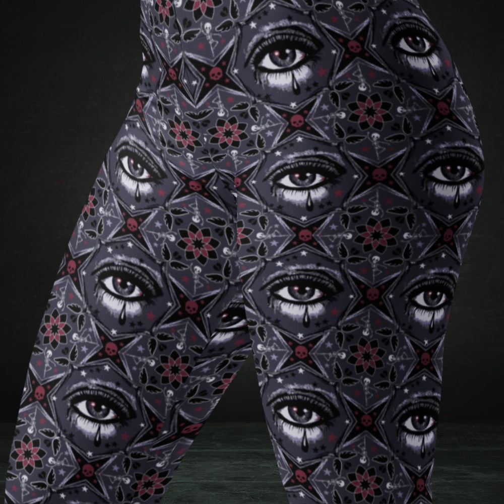 Grey kaleidoscope like leggings with crying eyes and emo symbols