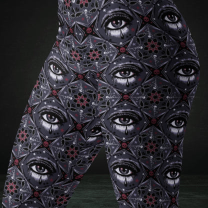 Grey kaleidoscope like leggings with crying eyes and emo symbols