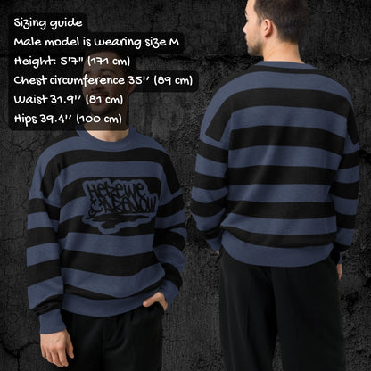 Two people wearing a blue and black striped grunge knitted sweater with sizing information displayed.