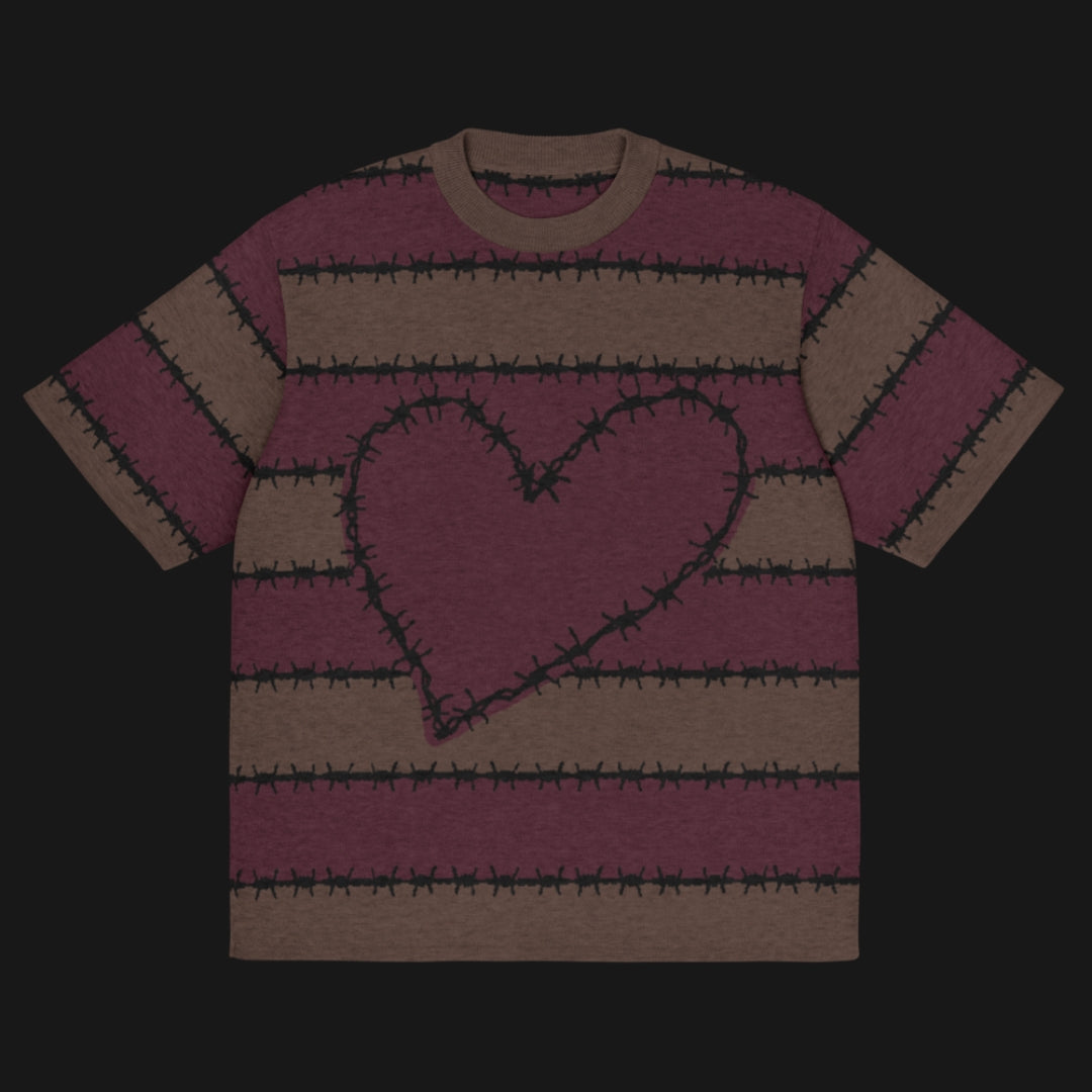 A jacquard knitted tee in dark moody shades, featuring stripes and a large heart lined with barbed wire