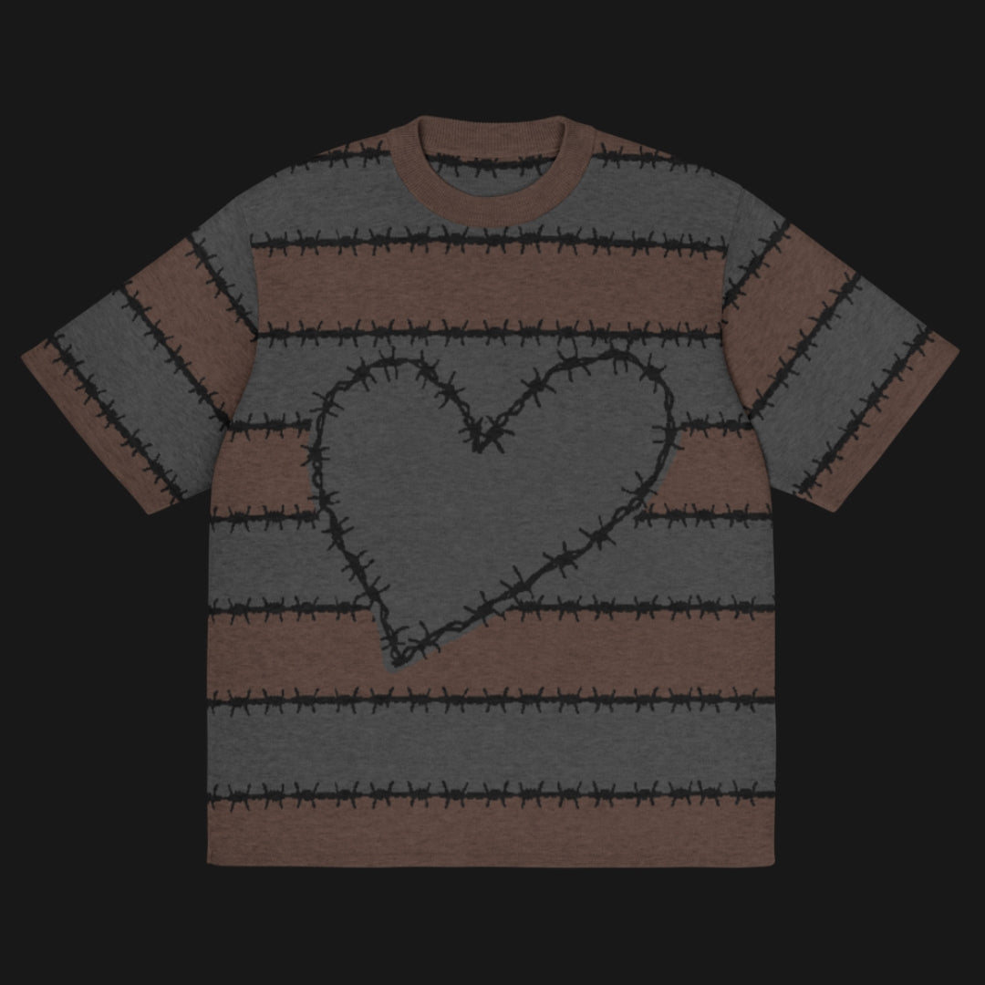A jacquard knitted tee in dark moody shades, featuring stripes and a large heart lined with barbed wire