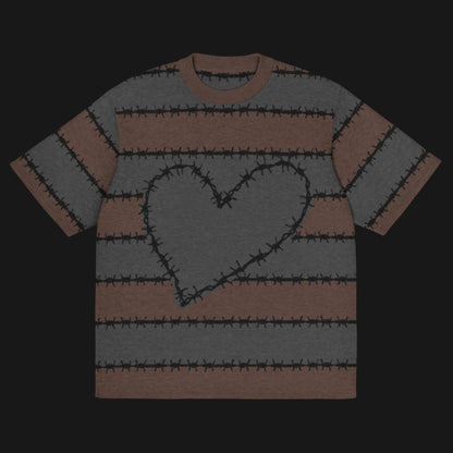 A jacquard knitted tee in dark moody shades, featuring stripes and a large heart lined with barbed wire