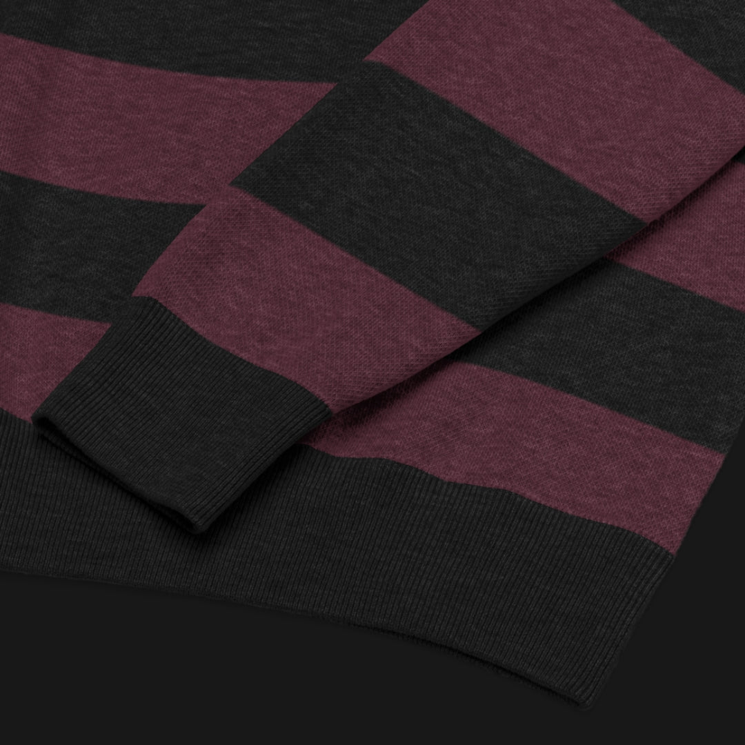 a grunge striped sweater with wide black and dark stripes