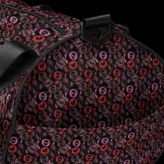 Duffel bag with a skull candy pattern in red crushed velvet shades