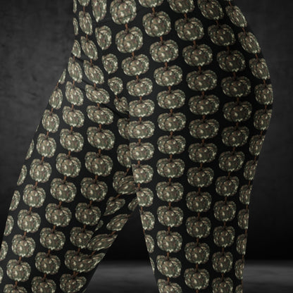 leggings with camouflage colored pumpkins on black background