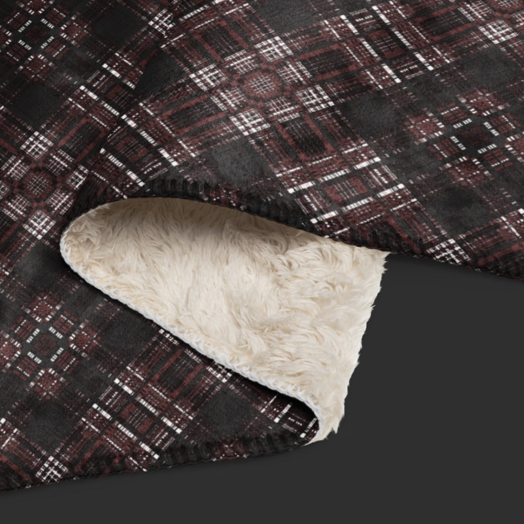 a fleece sherpa blanket with a dark alt emo colored plaid pattern