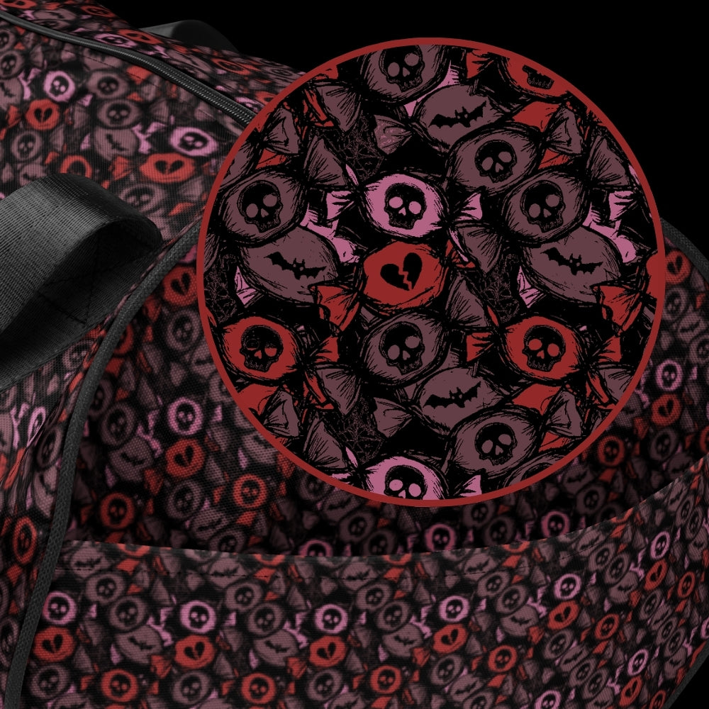Duffel bag with a skull candy pattern in red crushed velvet shades