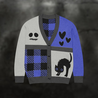 A blue, grey and black knitted cardigan with patchwork pattern areas