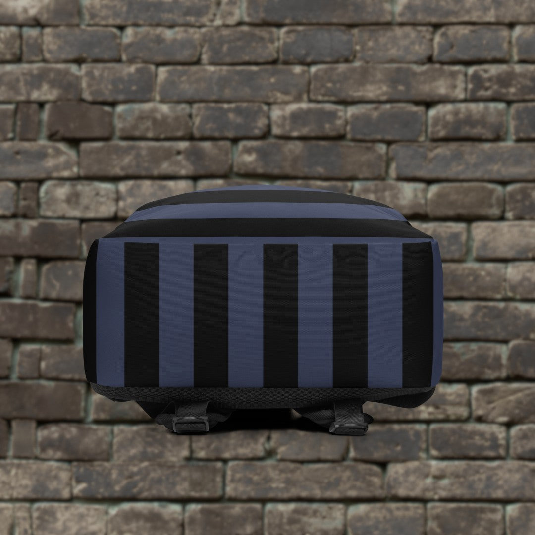 Backpack with blue and black grunge style dark stripes and text "here we are now" in graffiti tag style