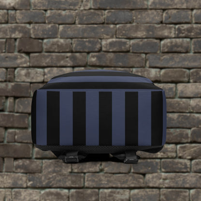 Backpack with blue and black grunge style dark stripes and text "here we are now" in graffiti tag style