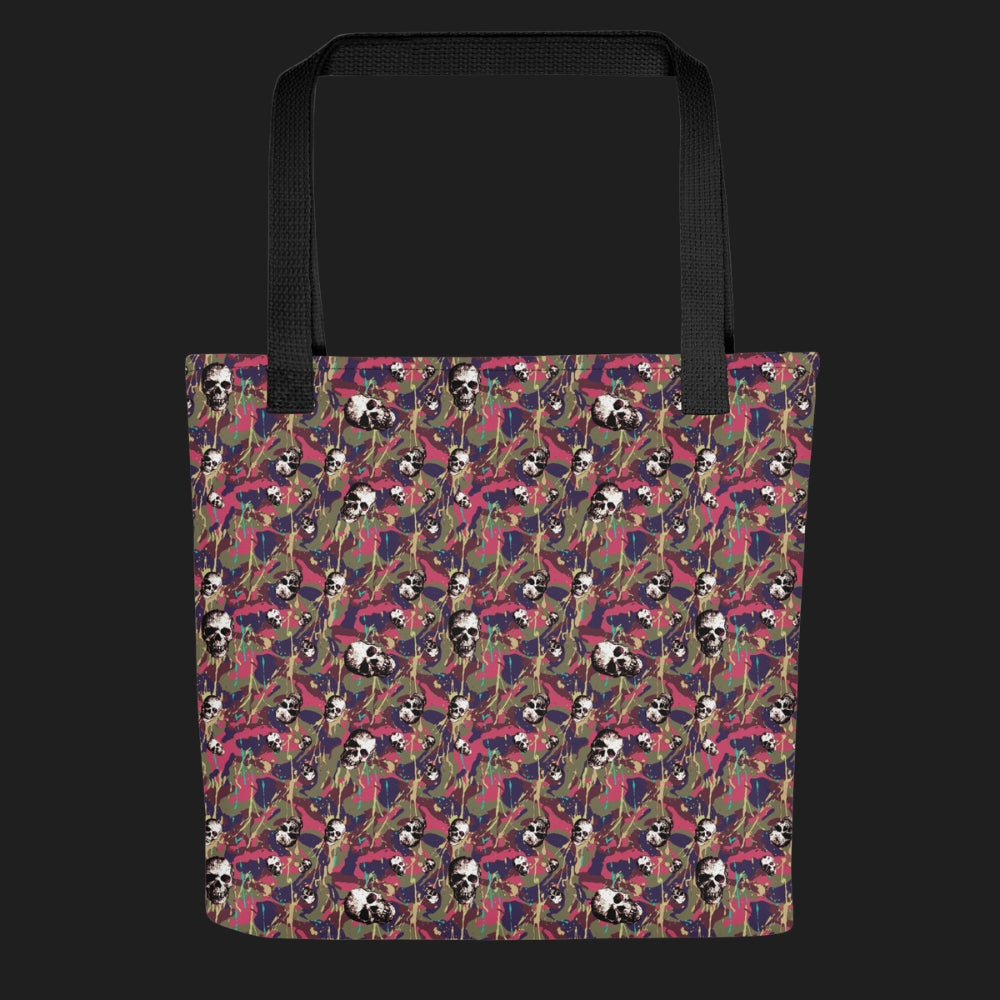 Tote bag with a rebellious camo background, gritty skulls, and purple pink paint splatter
