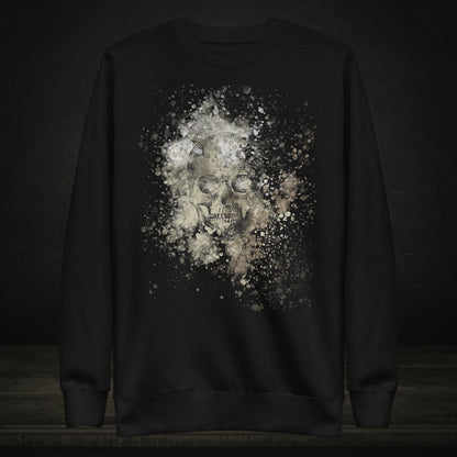 A black cotton heritage M2480 sweatshirt with a subtle skull graphic surrounded and overlaid with paint splatter in camouflage colors