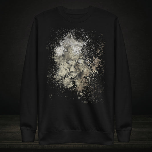 A black cotton heritage M2480 sweatshirt with a subtle skull graphic surrounded and overlaid with paint splatter in camouflage colors