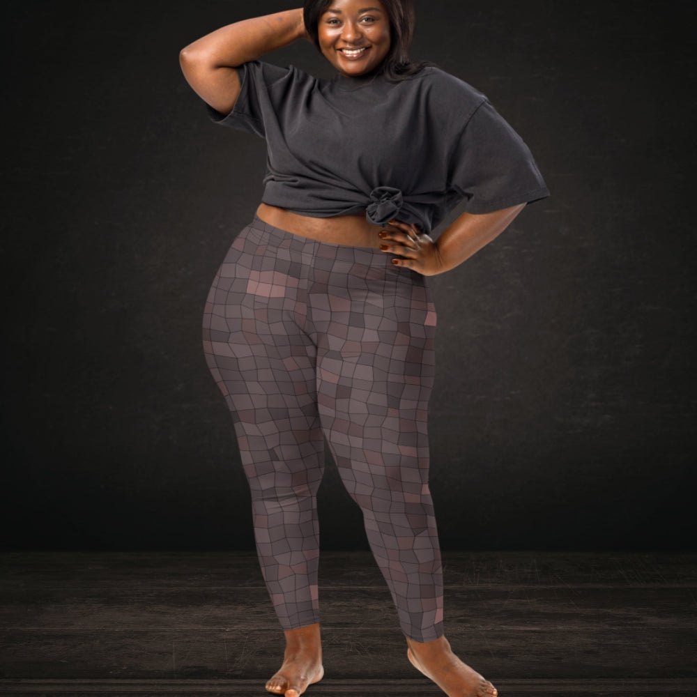 Person wearing leggings with an irregular distorted mosaic pattern in dusty burgundy shades