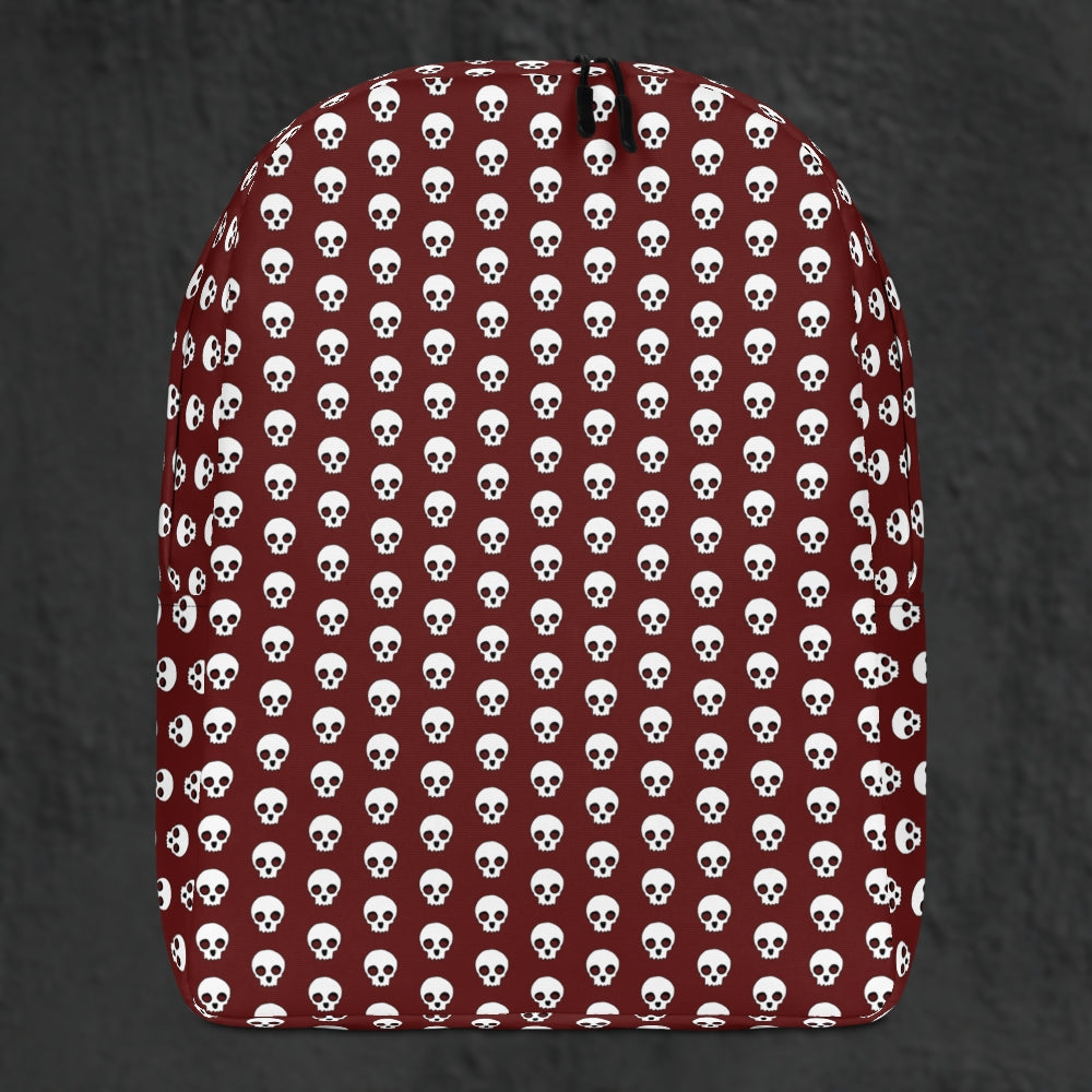 a backpack with a skull pattern on deep red