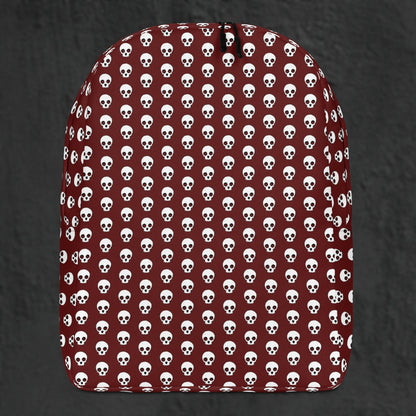 a backpack with a skull pattern on deep red