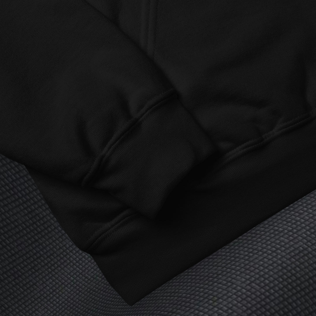 Close-up of a black gildan 18500 fabric texture on a dark background