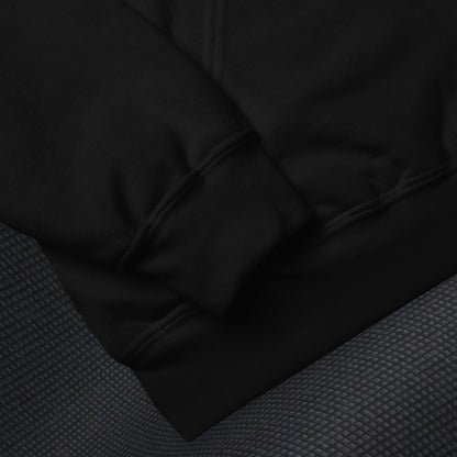Close-up of a black gildan 18500 fabric texture on a dark background