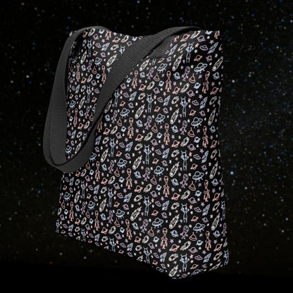 Tote bag with a cool hand drawn space pattern with confused aliens and planets in pastel on black