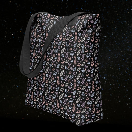 Tote bag with a cool hand drawn space pattern with confused aliens and planets in pastel on black