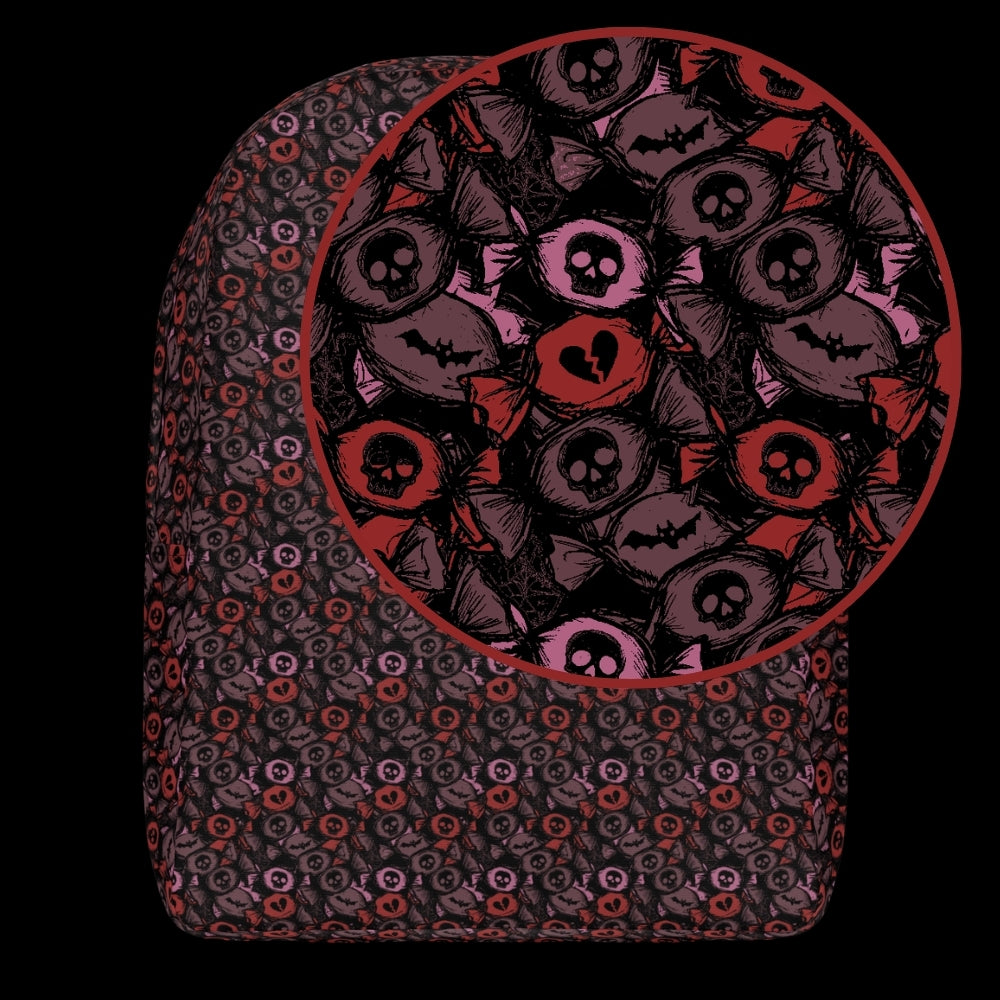 a backpack with an alt emo skull candy pattern in burgundy pink and red