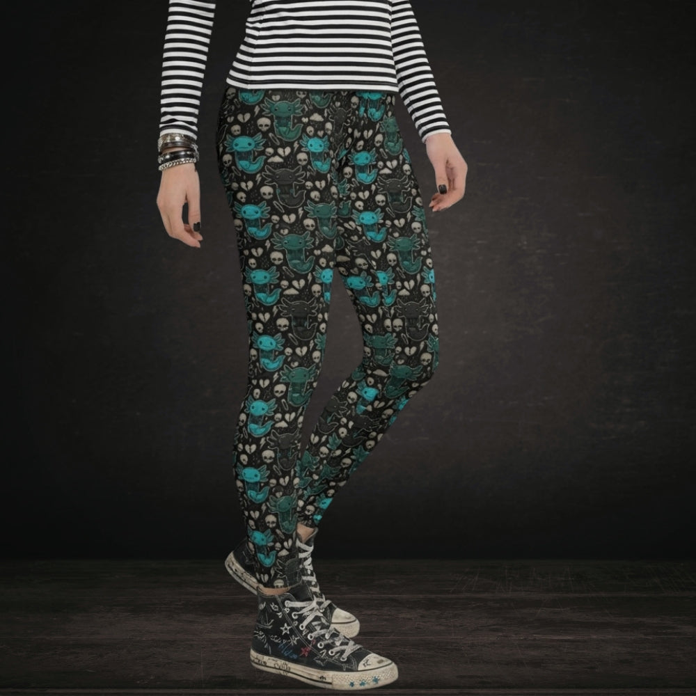 Alt style person wearing leggings with teal and grey emo axolotls.