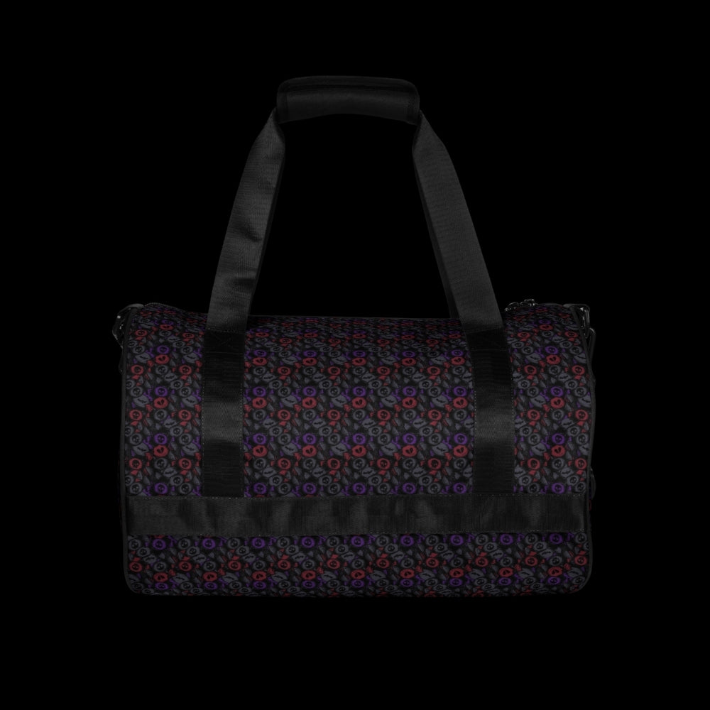 Duffel bag with a skull candy pattern in dark grey blue and red shades