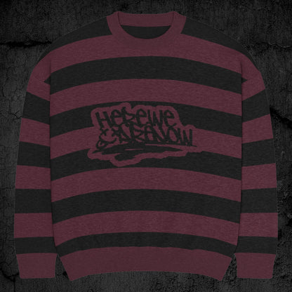 Black and burgundy grunge striped knitted sweater with a text "here we are now" in graffiti tag style, on a dark textured background