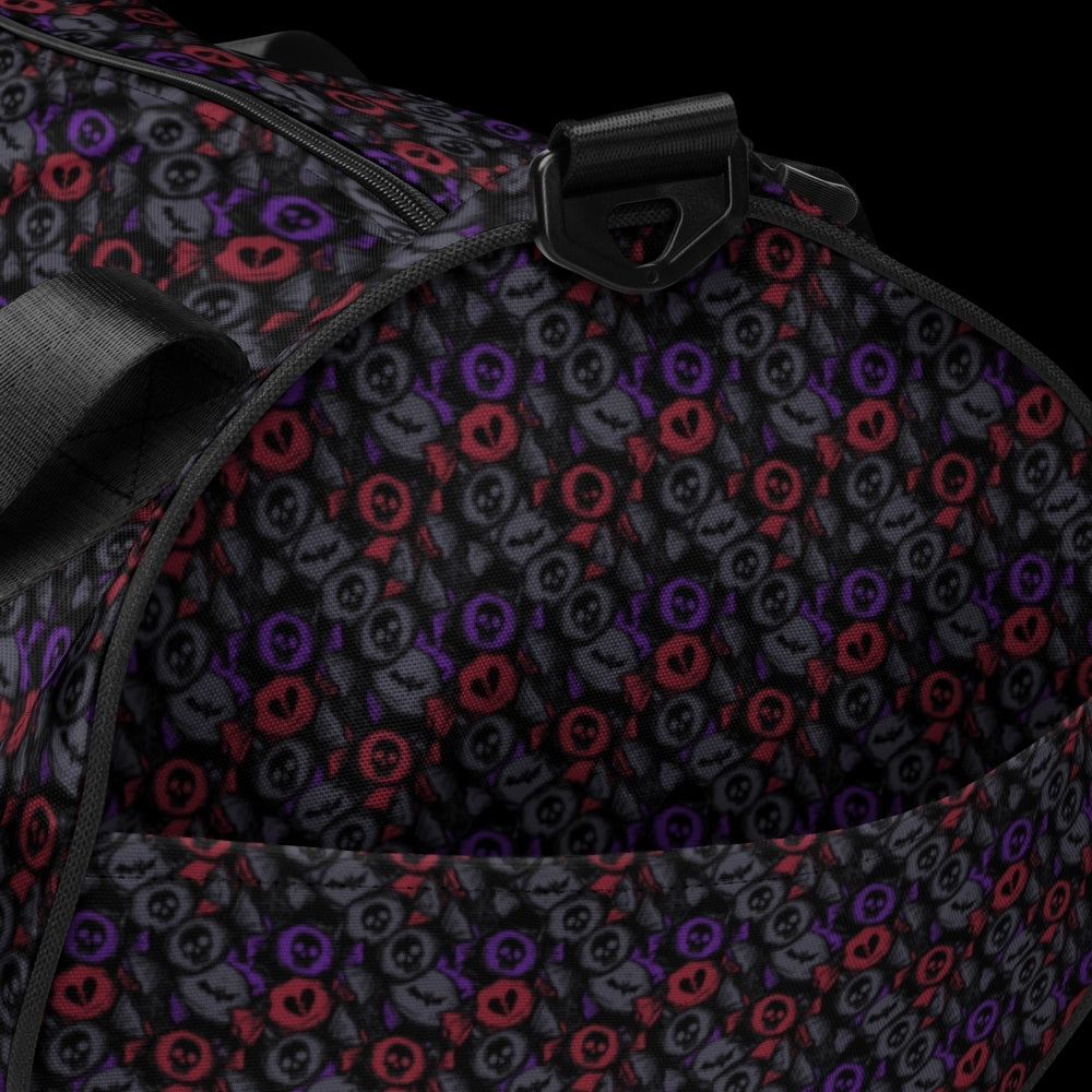 Duffel bag with a skull candy pattern in dark grey blue and red shades