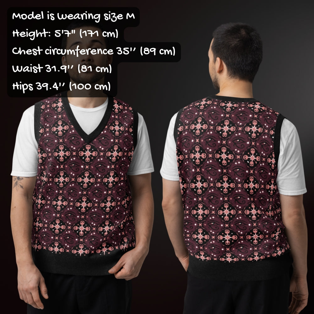 person wearing a knit vest with a mysterious eye and skulls pattern in burgundy and pink with sizing info