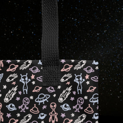 Tote bag with a cool hand drawn space pattern with confused aliens and planets in pastel on black