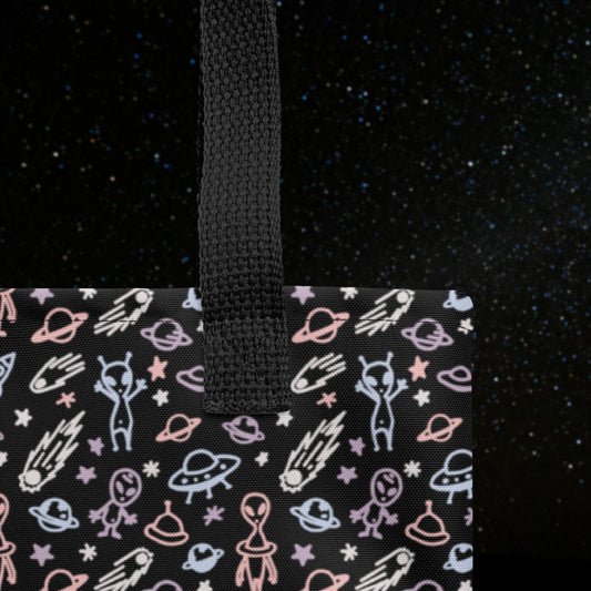 Tote bag with a cool hand drawn space pattern with confused aliens and planets in pastel on black