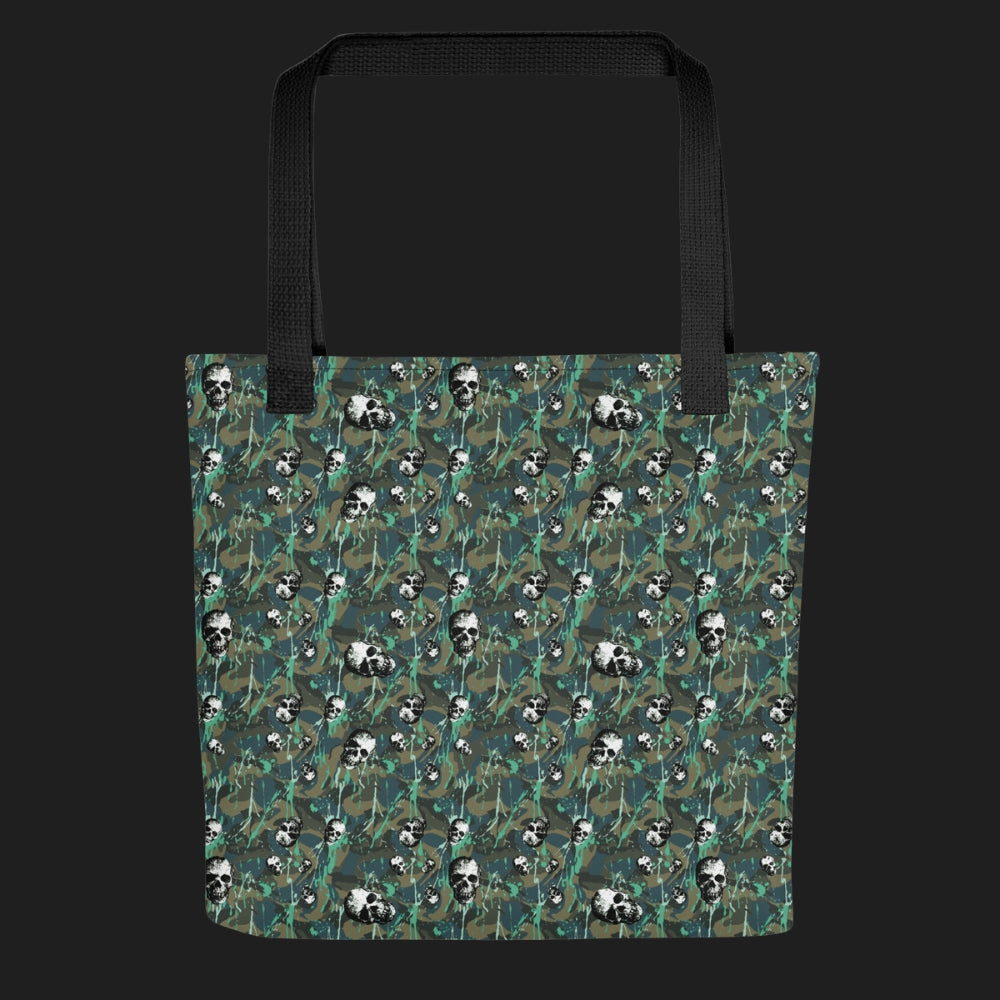 Tote bag with a rebellious camo background, gritty skulls, and teal paint splatter