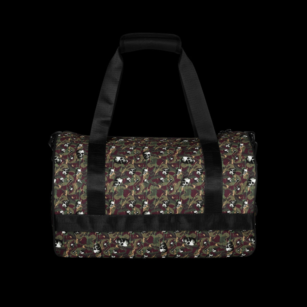 a duffel gym bag with a camo, paint splatter, and gritty skulls pattern in green and burgundy shades