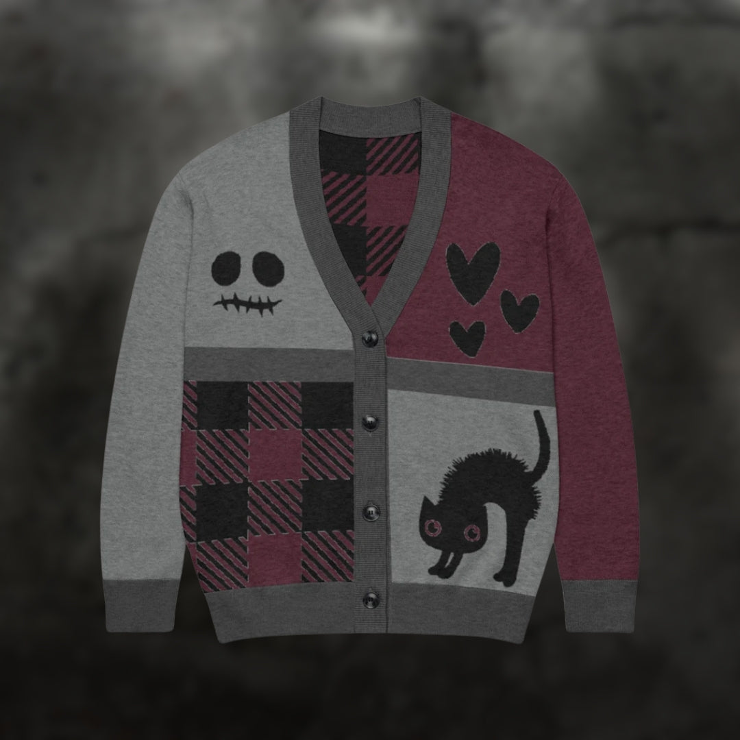 A burgundy, grey and black knitted cardigan with patchwork pattern areas