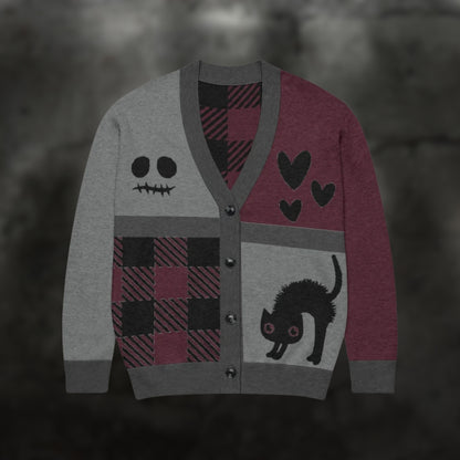 A burgundy, grey and black knitted cardigan with patchwork pattern areas