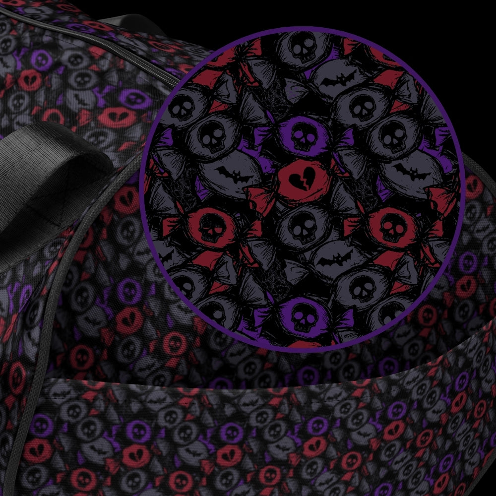 Duffel bag with a skull candy pattern in dark grey blue and red shades