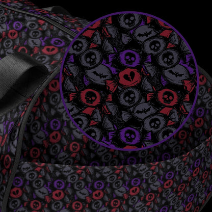 Duffel bag with a skull candy pattern in dark grey blue and red shades