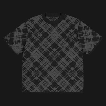 A dark black and charcoal broken plaid pattern knitted tee