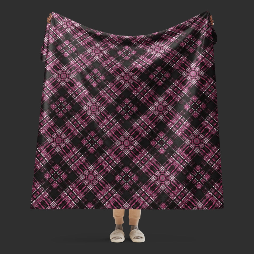 a fleece sherpa blanket with a purple alt emo colored plaid pattern