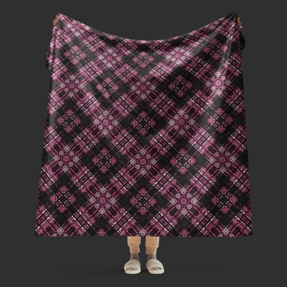 a fleece sherpa blanket with a purple alt emo colored plaid pattern