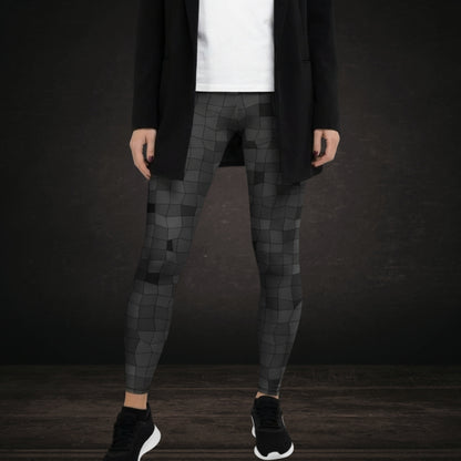 Person wearing leggings with an irregular distorted mosaic pattern in grey shades