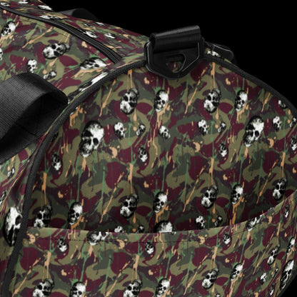 a duffel gym bag with a camo, paint splatter, and gritty skulls pattern in green and burgundy shades