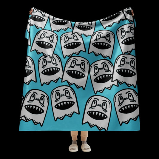 a large sky blue fleece sherpa blanket with grinning goblins