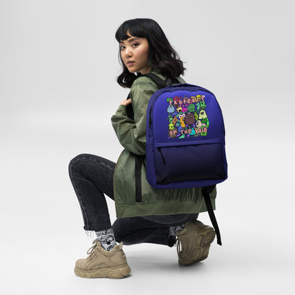 emo scene style blue-black medium size backpack with colorful monster print and text "property of the void"