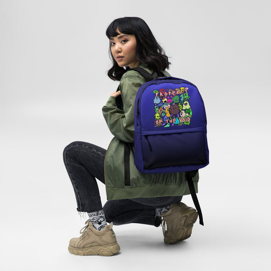 emo scene style blue-black medium size backpack with colorful monster print and text "property of the void"